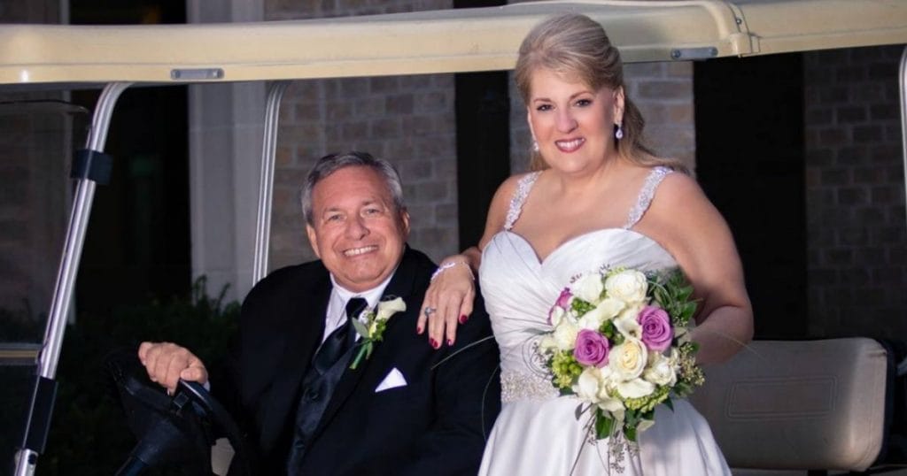 Mr and Mrs Gallagher wedding picture on a golf cart